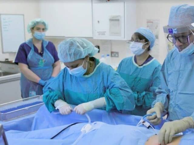 Professor Mohammed Munavvar (far right) and his team at work under the watchful eye of a worldwide medical audience [image: Lancashire Teaching Hospitals]