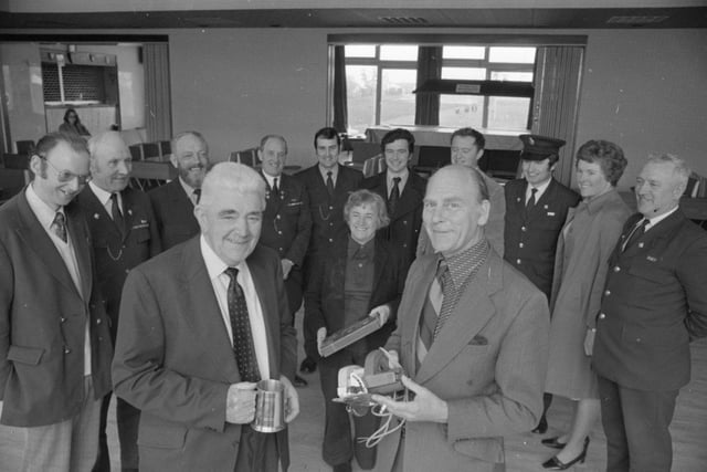 Prison officer Ralph Beaumont retired in  He is pictured receiving his retirement presents from the other Beaumont - prison governor Mr Jack Beaumont (front right)