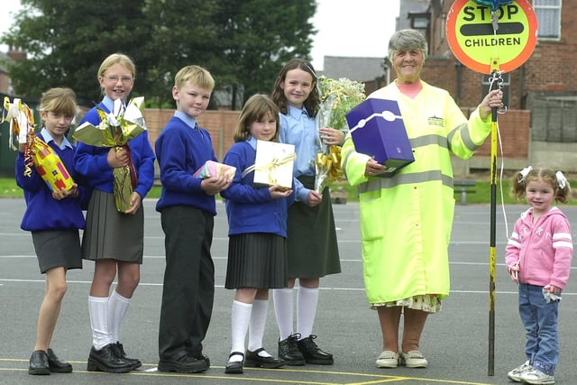 Lollipop lady Margaret Brown retired after 35 years of helping Layton Primary School pupils across the road. This was in 2002. Queueing up to hand over their presents are L-R: Rebecca Blayney, Lucy Hugill, Matthew Watson, Rebecca Staff, Abigail and Maisie Cross (Margaret's grandchildren).