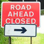 General view of a road ahead closed sign.