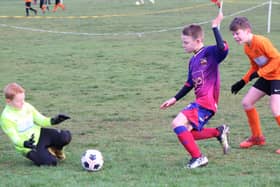 Match action between YMCA Orange Under-10 and Fylde Coast Soccer Messis