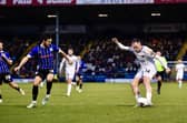 Josh Kay tries his luck for AFC Fylde at Rochdale  Photo: STEVE MCLELLAN