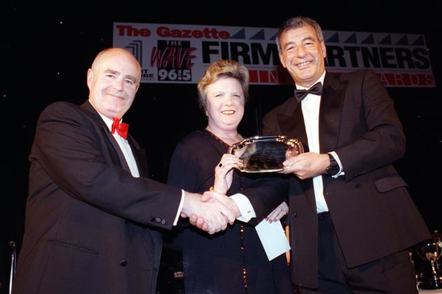 Firm Partners Business Awards in 1998. Pictured are Philip Scully and Beverly Lester of the Blackpool, Wyre and Fylde Community Health Trust receiving the Success Through Training Award from Tony Bickerstaffe of Lawtec