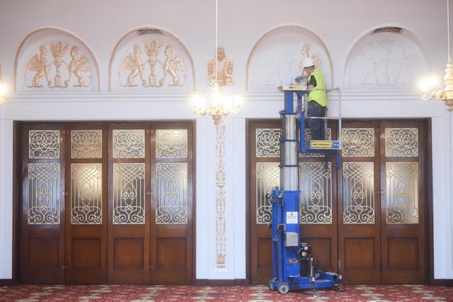 Inside the Renaissance Room, the decorative plasterwork is being painted gold, restoring it back to how it world have looked in 1931