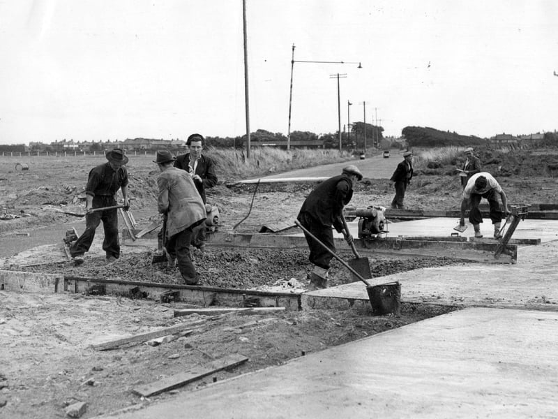 Workmen taking the new runway at Blackpool Airport across Leach Lane in August, 1953. It meant new road links between St Annes and Marton