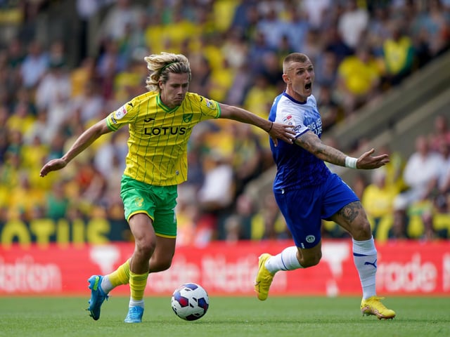 Norwich City's Todd Cantwell (left) and Wigan Athletic's Max Power battle for the ball during the Sky Bet Championship match at Carrow Road, Norwich. Picture date: Saturday August 6, 2022. PA Photo: Joe Giddens/PA Wire.
