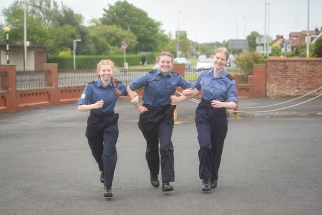 Three Blackpool Sea Cadets are running and cycling to 70 post boxes across the Fylde Coast to raise money for new canoes.  Pictured are Amelia Morris, Grace Ryan and Madeline Bell.