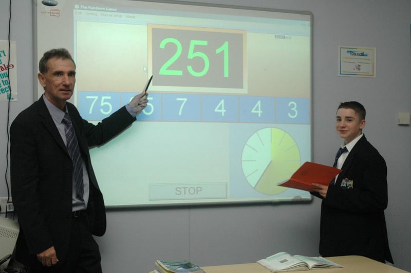 Maths teacher Mr Mullen with Ashley Edwards on an interactive countdown game, 2006