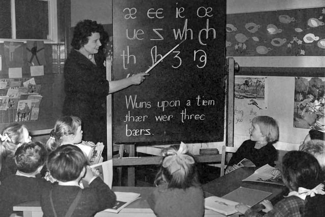 Headmistress Miss D S Ford teaching children of Devonshire Road Infants School the new initial teaching alphabet (ITA) in 1964