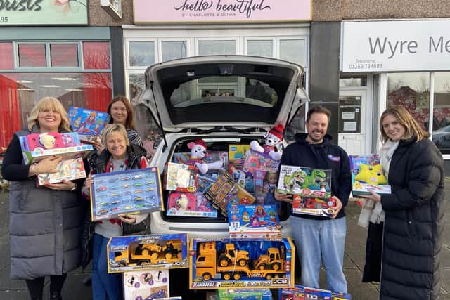 Janet Lay (left) and daughter Charlotte (right) with the the donated toys to Tina Burke, Family Support Worker, Intensive Support Team, Lancashire County Council,
Paula Mann, Senior Family Support Worker, Intensive Support Team, Lancashire County Council and John Filmer of Hope Church and Forget-Me-Notts.