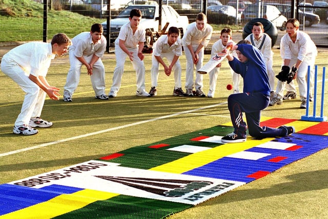 Eleven-year-old Luke O'Dea tries out the new artificial cricket wicket at Lytham St Annes High School, with no shortage of slip fielders