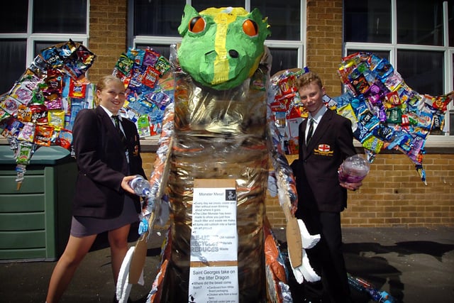 Pupils built a litter dragon as part of their newly-launched Environmental Club. Stephanie Best and Daniel Hadden feed the dragon in 2006