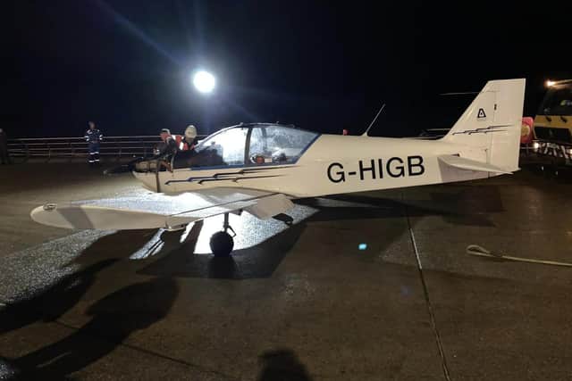 Rescue crews recovering the plane after it was forced to make an emergency landing on the beach in South Shore last night (Thursday, November 16). (Picture by Tatiana Dunderdale)