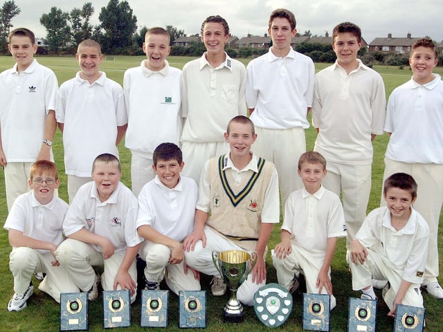 Clipstone Under 13s cricket team from 2001 with their trophy haul.