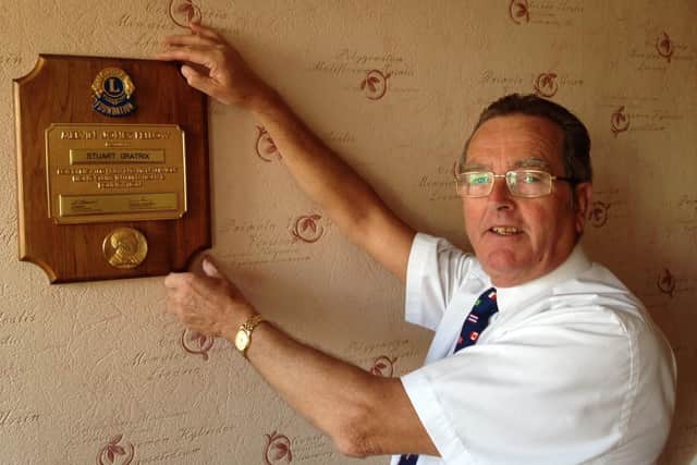 Fleetwood Lions Club member Stuart Gratrix with an award for service to Lions Club International.