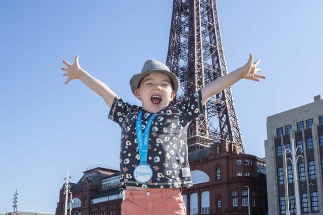 Charlie Barratt, 6, in front of Blackpool Tower.