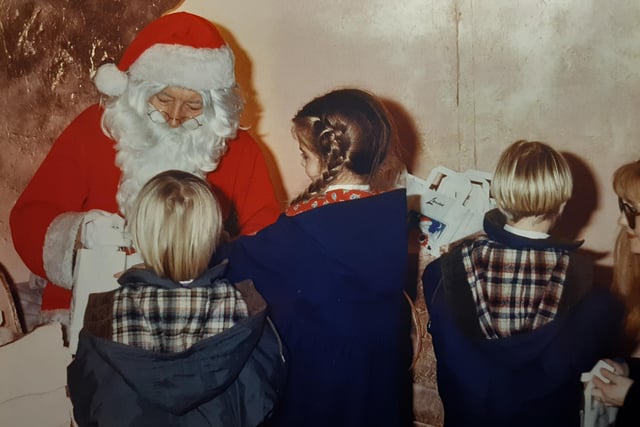 Father Christmas meets children at the Lewis's Store grotto in 1990