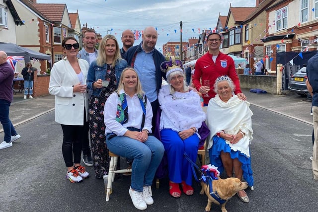 Residents of Galloway Road in Fleetwood gather around the street's longest established resident, Christine Riley, who was crowned Queen for the day as part of the  Platinum Jubilee celebrations.