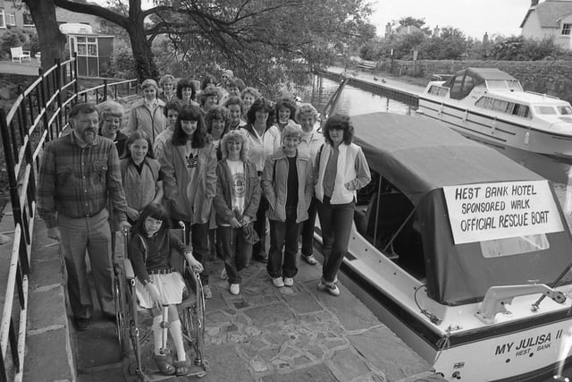 Twenty-two women from the Hest Bank Hotel marched 10 miles along Lancaster canal to earn £350. Part of the cash will buy badly-needed kit for Hest Bank FC, near Lancaster. The rest will be sent to buy a unique device to be used to lengthen legs at the Royal Manchester Children's Hospital. A similar device has been used successfully to get nine-year-old Andrew Procter of Coastal Road, Hest Bank, walking again. Andrea is pictured with volunteers at the start of the walk