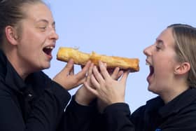 Becky and Carla at Bowens Pies Chorley with one of the giant sausage rolls.