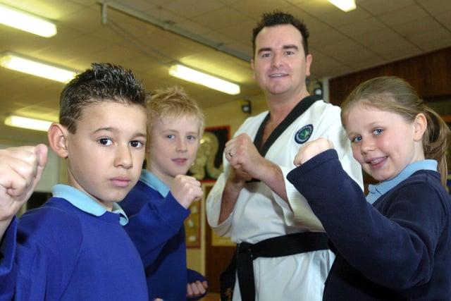Pupils at Stanah Primary School were being taught how to deal with bullies by Taekwondo teacher Master Lee Heyes. Pictured left to right are Lewis Thompson (9), Alex Evans (10), Master Lee Heyes and Ellie Masterson (9) in 2006