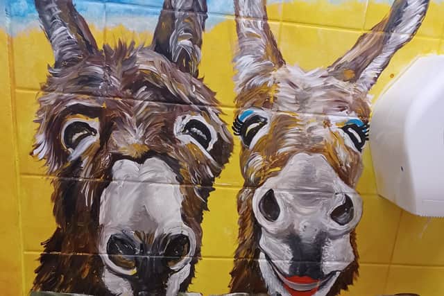 Two donkeys are part of a Promenade themed mural in the Ashcroft nursery toilets