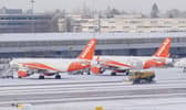 Snowploughs clearing snow at Manchester Airport. Picture by Martin Rickett. Credit: PA Wire/PA Images