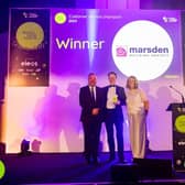 Marsden’s Phil Relf (centre) collecting the Customer Service Champion award