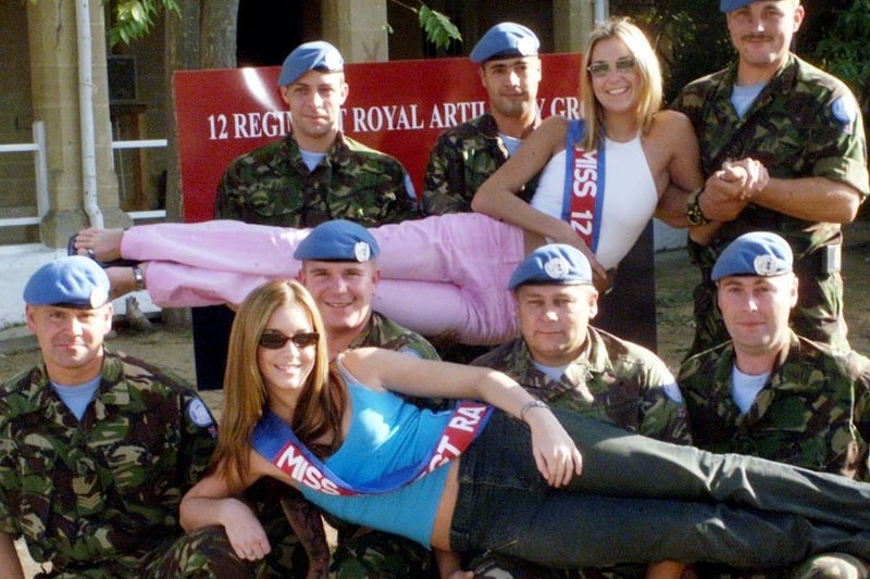 Army troops in Cyprus with The Gazette's Face of 2001, Heidi Van Cliff (blue top) and Miss Blackpool 2000 Natalie James