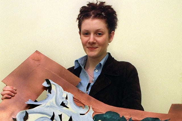Joanna Smith with her collage depicting the elements, 1999