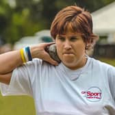 Claire Buckle participating in the shot put