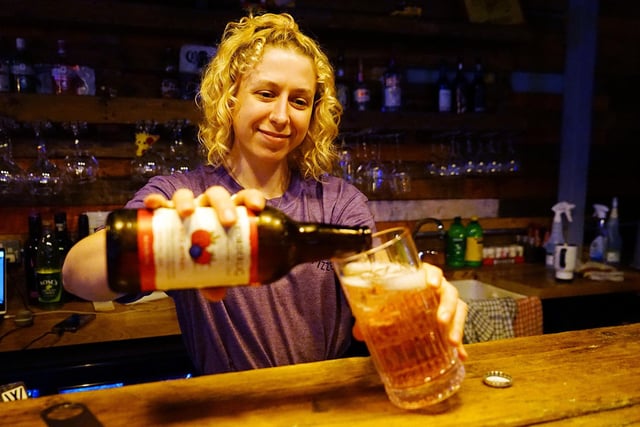 Tori Pearce pouring a drink.
