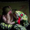 Pictured is Ruth Collinge as Eve the Snake Charmer