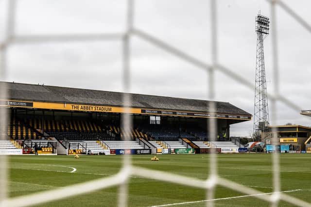 Blackpool are in action against Cambridge United at the Abbey Stadium