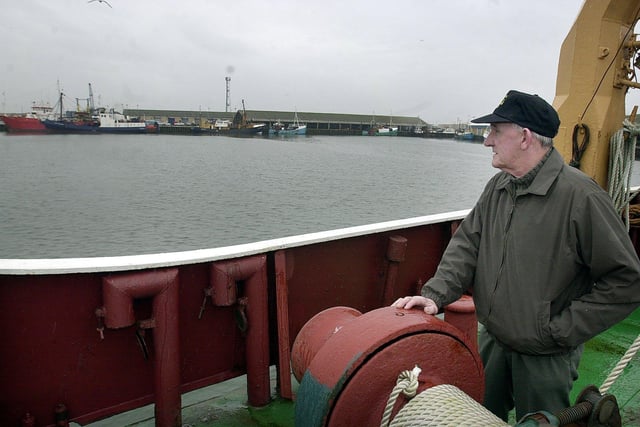 Retired trawler skipper Dick Farrer looks out across the docks in 2001