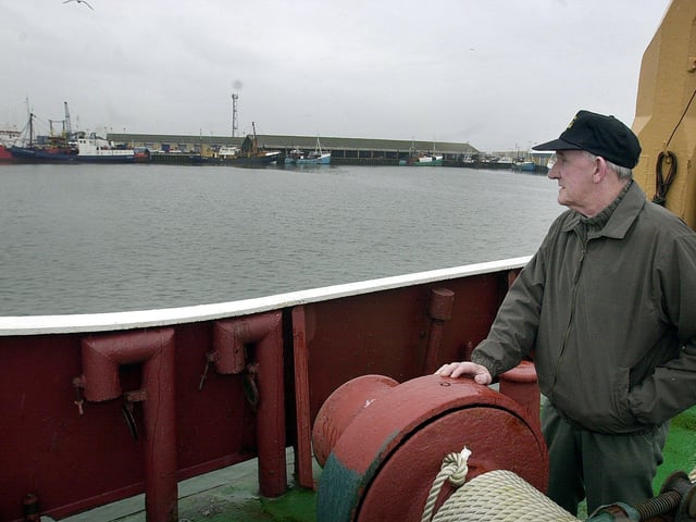 Retired trawler skipper Dick Farrer looks out across the docks in 2001