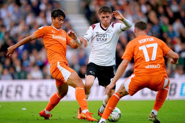 Blackpool claimed a 2-0 victory over Derby County