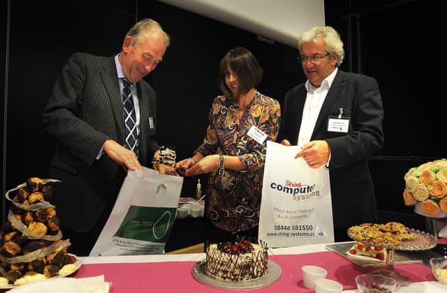 A Wyred Up networking event for business people, held at Blackpool Sixth Form College in 2013.
Jill Bleasdale from A Slice of Heaven serves slices of cake to Jim Baker from Jones Harris Accountants (left) and Nigel Bennett from String Computer Systems.