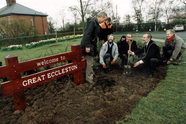 Visitors to Great Eccleston will receive a warmer welcome thanks to a new sign. Councillor George Roper, the Mayor, plants the first shrub next to it in