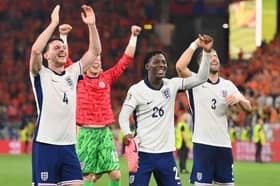 Declan Rice, Kobbie Mainoo and Luke Shaw celebrate after England beat the Netherlands during the UEFA EURO 2024 semi-final match.
