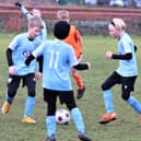 Action from our Blackpool and District Youth Football League match of the week between the Under-9s of YMCA Blues and CN Sports Marvels Picture: B&DYFL