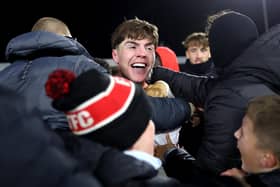 Northern Ireland U21 international Conor Haughey celebrates after scoring Fleetwood Town's winning penalty against Arsenal. 