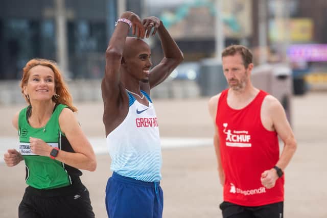A waxwork of Sir Mo Farah on the Comedy Carpet with his Great North Run kit to mark his final competitive race.  He is pictured with Steve Dunn from Blackpool, Wyre & Fylde Athletic Club and Linda Chadderton from Lytham St Annes Road Runner Club, who are both taking part in the GNR too..
