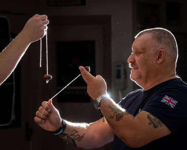 Stuart Ward tries his hand before refereeing the Bourne Arms Knott End and Preesall World Conkers Championship