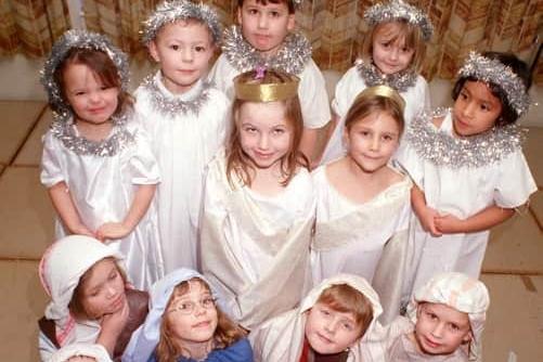 A host of angels from Goosnargh Oliverson's CE Primary School infants pose for the camera during their Nativity rehearsal in 1999