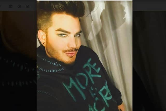 Singer Adam Lambert wearing a hooded top with a unique design by Lisa Marie Tart