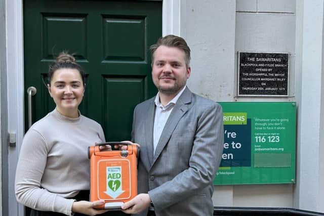 Showcasing the new defibrillator outside the Samaritans building on Edward Street