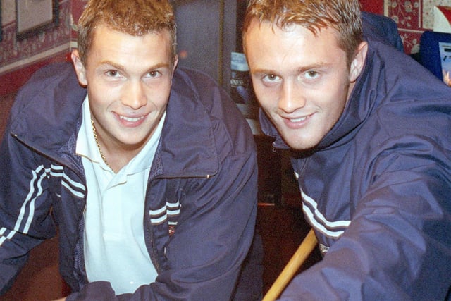 Blackpool FC players Phil Barnes (left) and Phil Robinson swapped their boots for cues, when they joined in the "pool challenge", at the Wheatsheaf Hotel celebrations, 1999