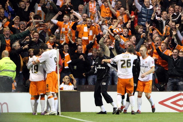 Adam celebrates with his teammates in front of his away end on the most magical of nights, as Blackpool booked their place in the final