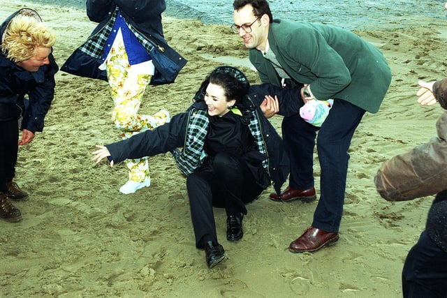 EastEnders actress Martine McCutcheon who played Tiffany , falls foul of the near gale force winds of Blackpool while filming on the beach, 1996